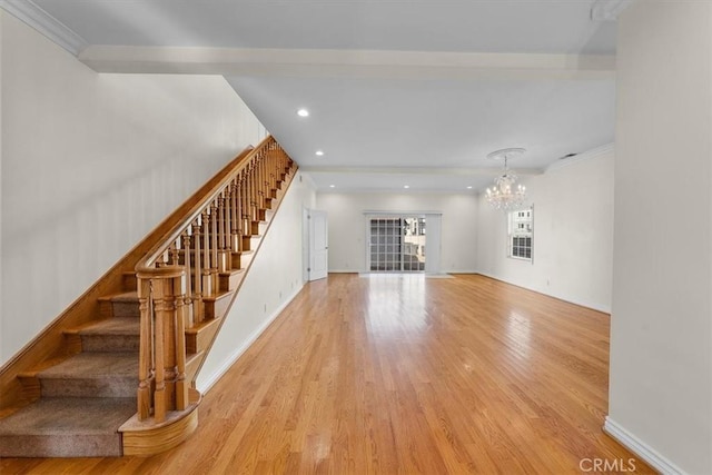 unfurnished living room featuring stairway, recessed lighting, baseboards, and wood finished floors