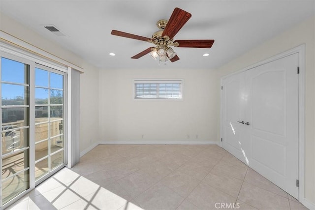 empty room with visible vents, recessed lighting, and baseboards