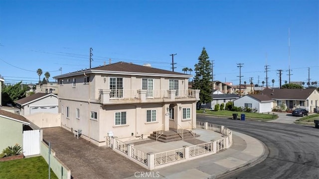 exterior space with a residential view and a fenced front yard