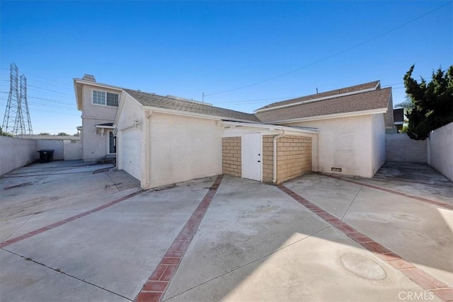 garage with fence