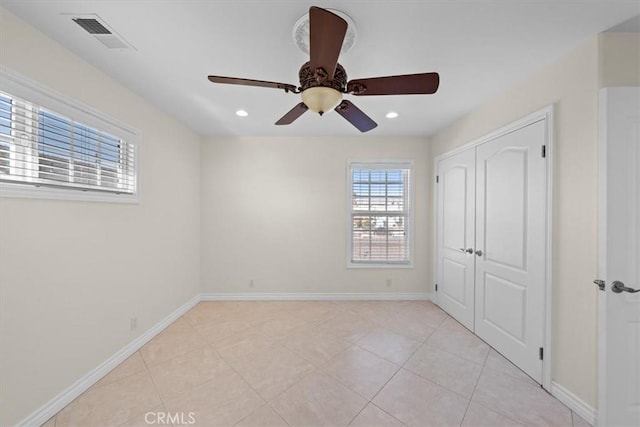 unfurnished bedroom featuring recessed lighting, baseboards, visible vents, and a closet