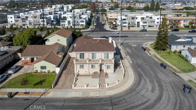 birds eye view of property with a residential view