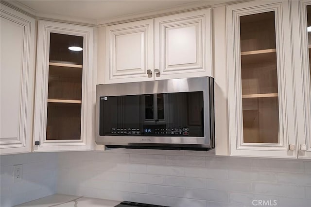 room details with white cabinets and tasteful backsplash