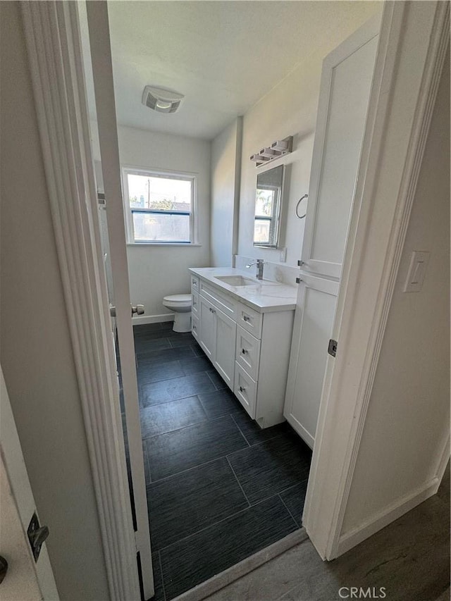 bathroom with vanity and toilet