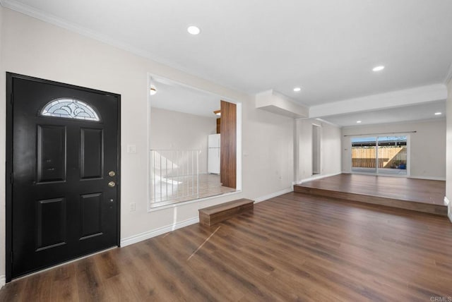 entryway featuring dark hardwood / wood-style floors and crown molding