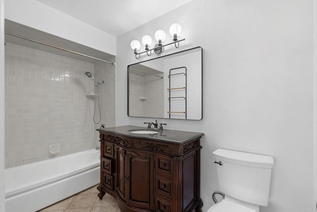 full bathroom featuring tile patterned floors, vanity, tiled shower / bath combo, and toilet