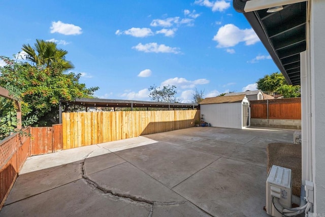 view of patio / terrace with a shed