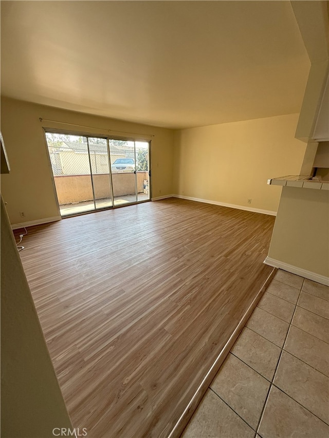 unfurnished living room with light hardwood / wood-style floors