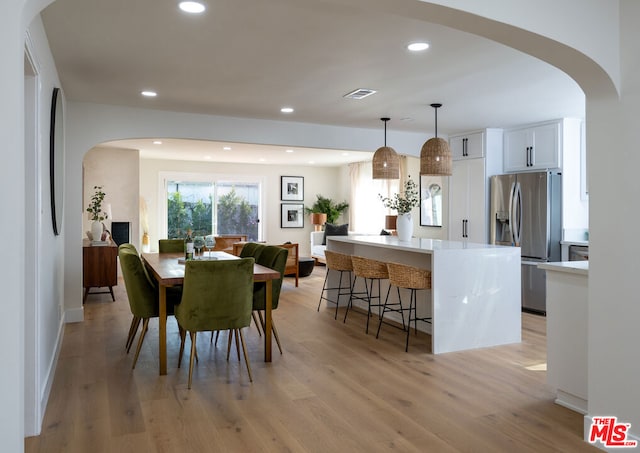 dining room with light hardwood / wood-style floors