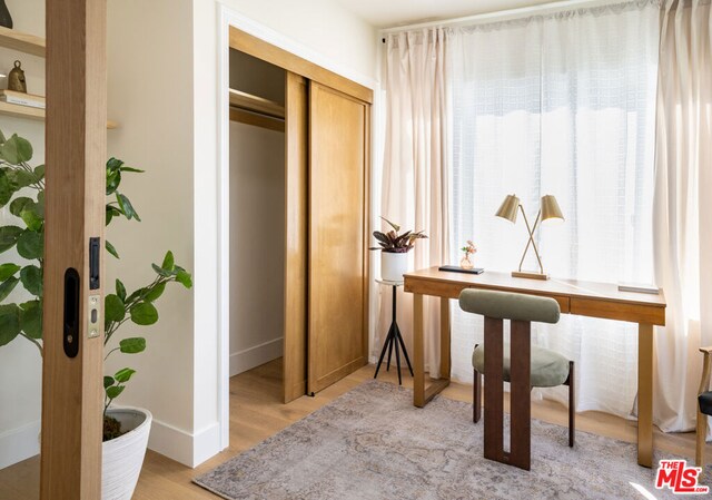 office space with light wood-type flooring