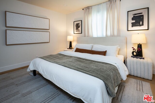 bedroom featuring wood-type flooring