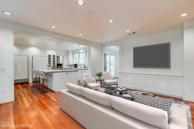 living room with light hardwood / wood-style flooring