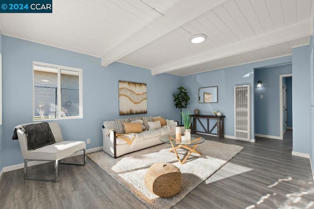 living room featuring beamed ceiling and dark hardwood / wood-style flooring