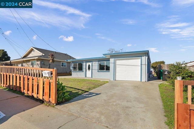 single story home with a front lawn and a garage