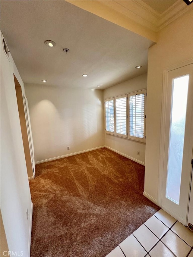 carpeted spare room with ornamental molding