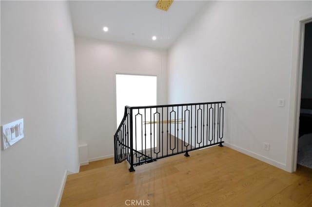 corridor featuring hardwood / wood-style floors