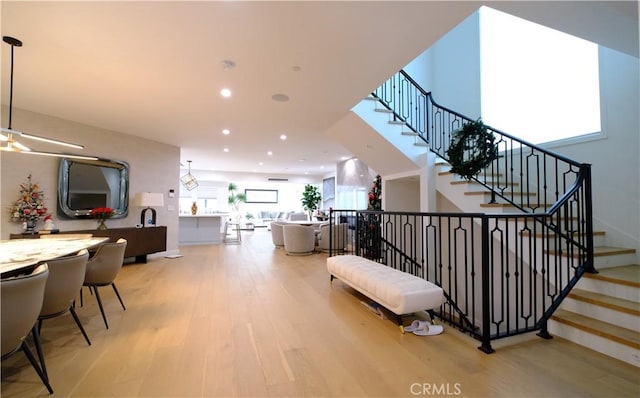 stairway with hardwood / wood-style flooring