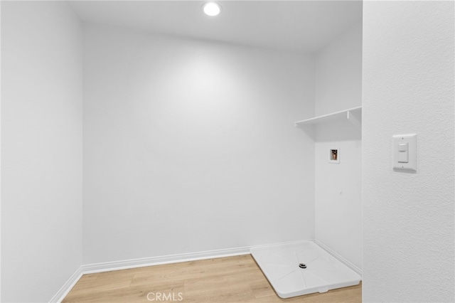 laundry area featuring hardwood / wood-style floors and washer hookup