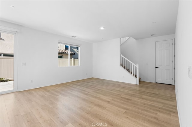 unfurnished living room featuring light hardwood / wood-style flooring