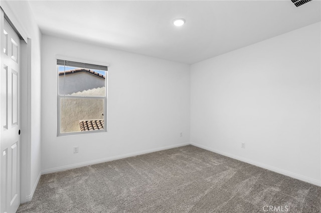 empty room featuring carpet flooring