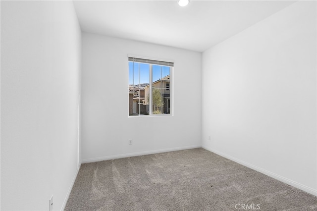 spare room featuring carpet flooring