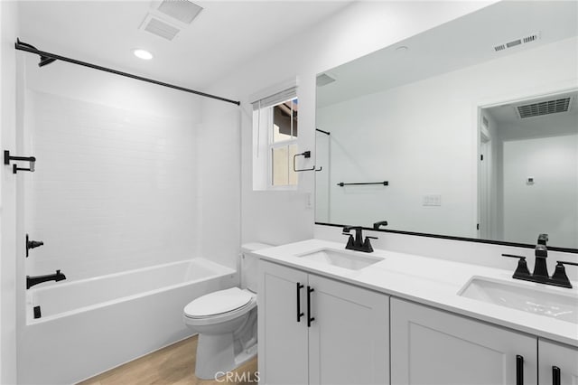 full bathroom with toilet, shower / washtub combination, vanity, and hardwood / wood-style flooring