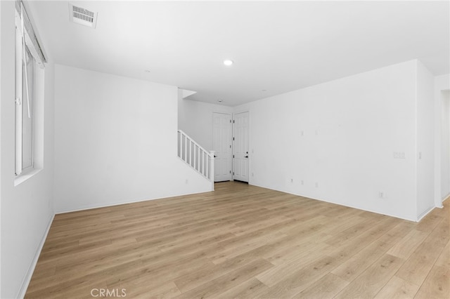 unfurnished living room with light wood-type flooring