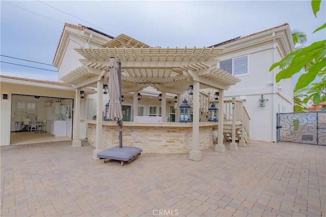 view of patio featuring a pergola