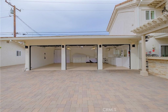 garage featuring washer and clothes dryer