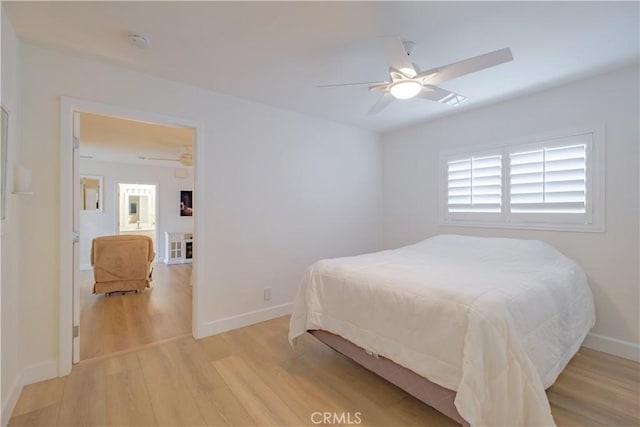 bedroom with ceiling fan and light wood-type flooring