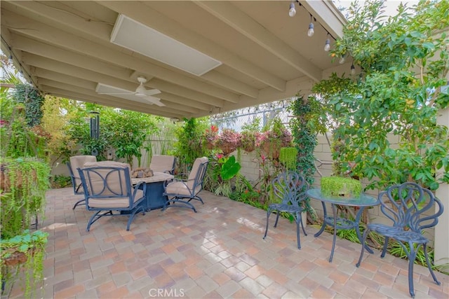 view of patio featuring ceiling fan