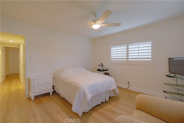 bedroom featuring ceiling fan and light hardwood / wood-style floors