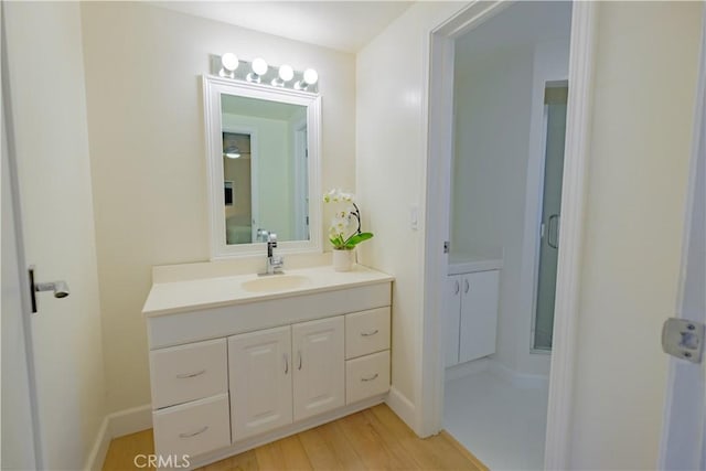 bathroom featuring wood-type flooring and vanity