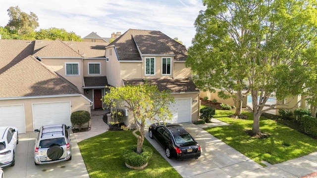 view of front facade featuring a garage and a front yard