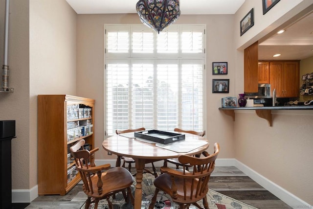 dining room with wood-type flooring