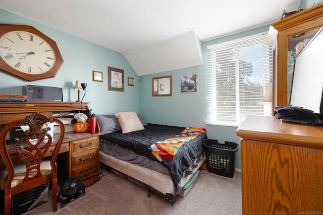 carpeted bedroom with lofted ceiling and multiple windows