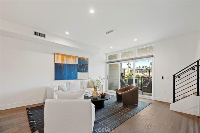 living room featuring dark wood-type flooring