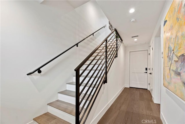 stairway featuring hardwood / wood-style floors