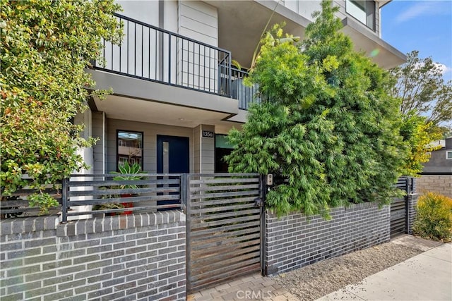 doorway to property featuring a balcony