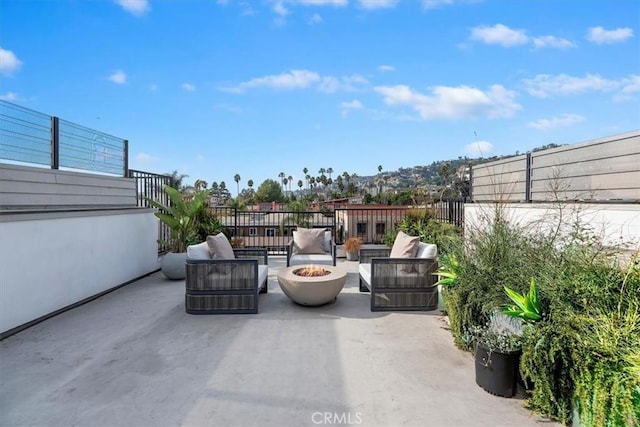 view of patio / terrace featuring an outdoor living space with a fire pit