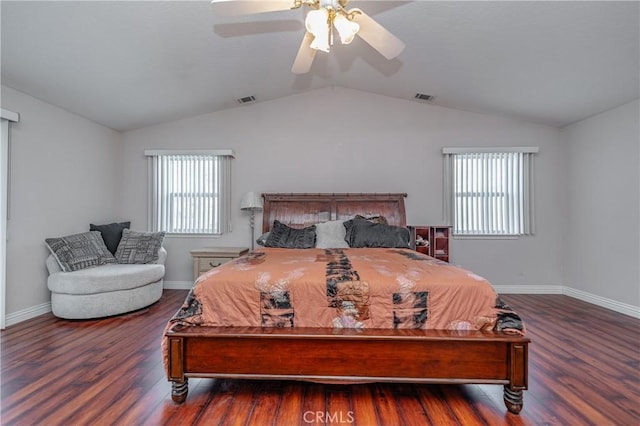 bedroom featuring multiple windows, ceiling fan, dark hardwood / wood-style flooring, and lofted ceiling