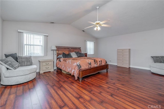 bedroom featuring ceiling fan, dark wood-type flooring, and lofted ceiling