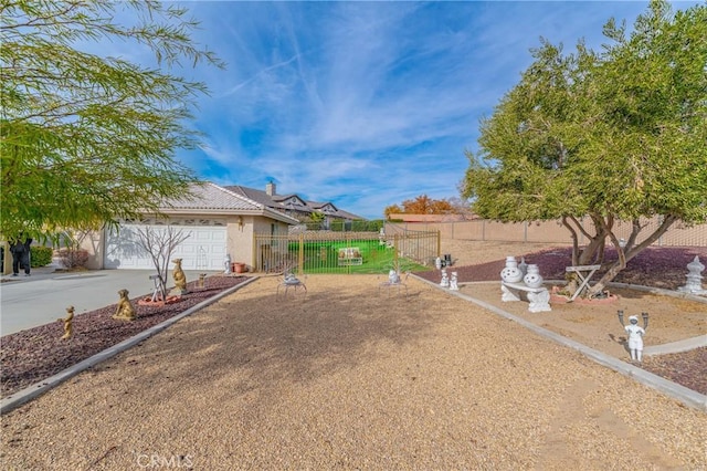 view of yard featuring a garage