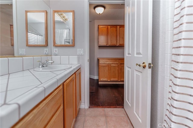 bathroom featuring hardwood / wood-style floors and vanity