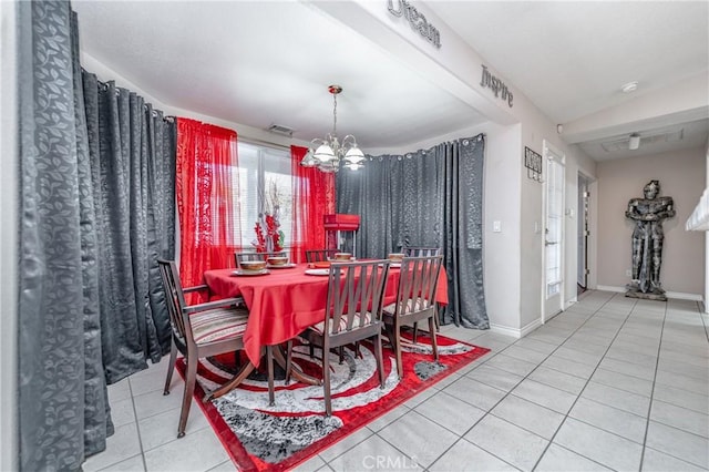 dining space with lofted ceiling, a notable chandelier, and light tile patterned flooring