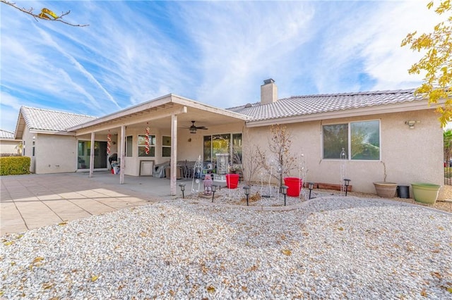 back of property featuring a patio area and ceiling fan