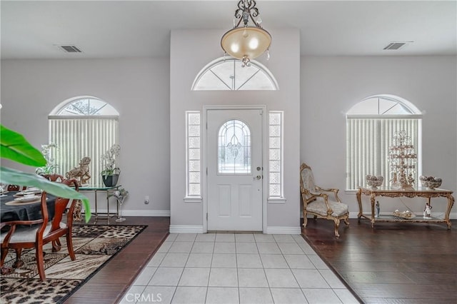 foyer entrance with light hardwood / wood-style floors