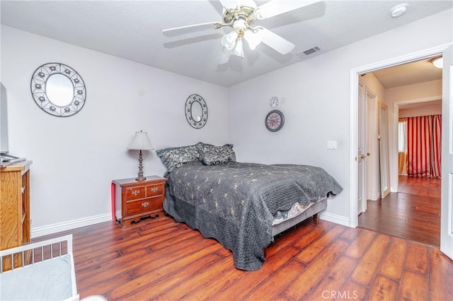 bedroom featuring ceiling fan and dark hardwood / wood-style flooring