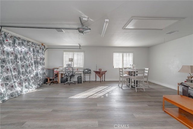 dining room with hardwood / wood-style flooring