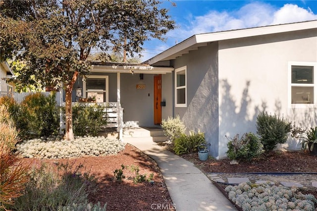 doorway to property with covered porch